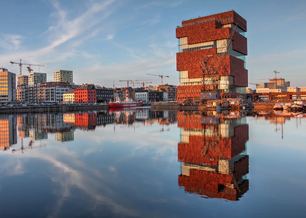 Antwerp, Belgium - April 5, 2014: Museum aan de Stroom (Museum on the stream, or simply MAS) bathing in the golden light of the sunset in Antwerp, Beligum on April 5th, 2014. The museum is a recent addition to Antwerp's skyline, opening in 2011.