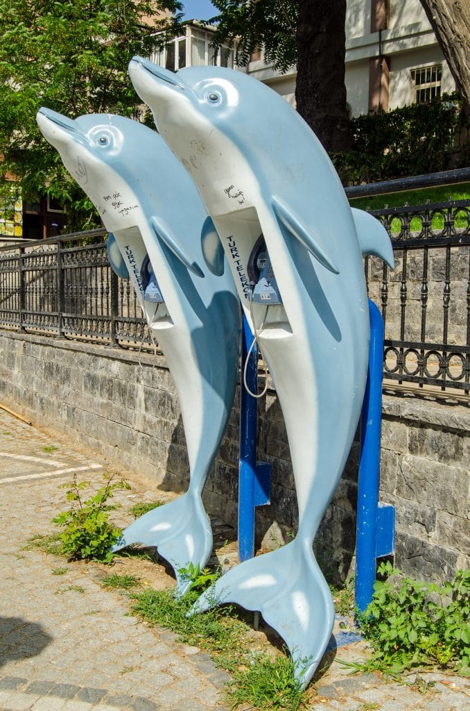 ISTANBUL, TURKEY - JUNE 6, 2016: Telephone boxes in the shape of dolphins on a pavement in the Beyoglu district of Istanbul, Turkey.; Shutterstock ID 459082234; PO: Press release